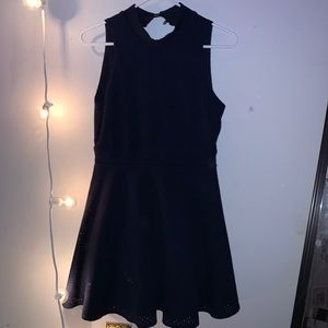 A short navy blue backless dress